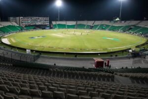 A cricket fielder diving to make a spectacular catch as fans watch in excitement, reflecting the growing appreciation of fielding skills.